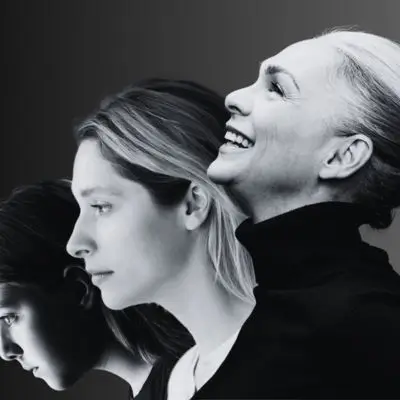 Young woman to happy older woman