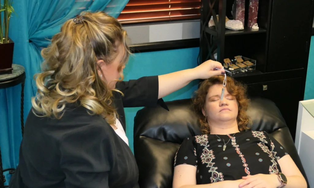 Anna working on the subconscious pattern of a client